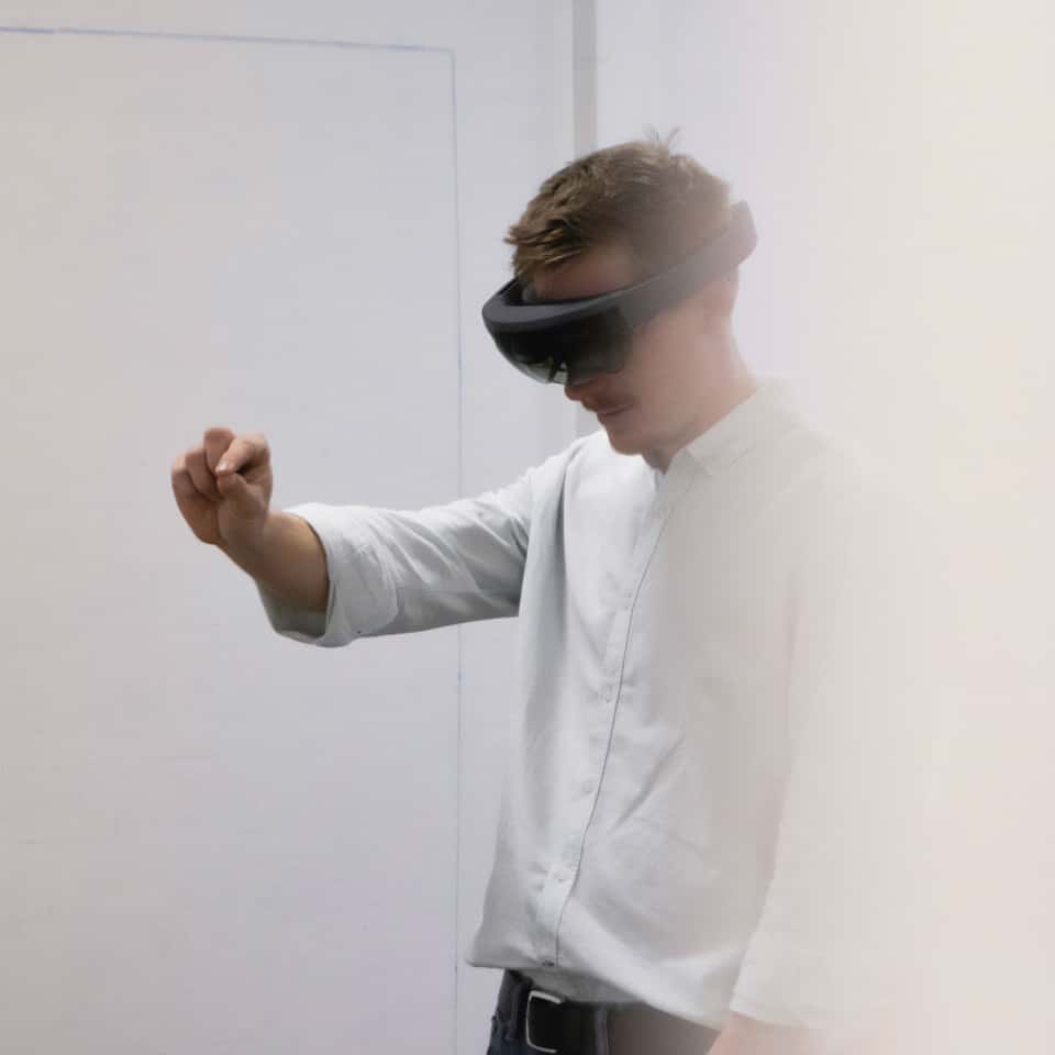 Claus Helfenschneider wearing a HoloLens headset